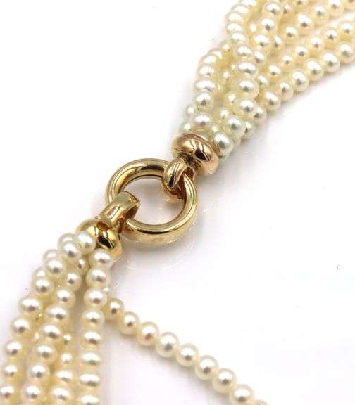Multi strand pearl necklace with yellow gold clasp