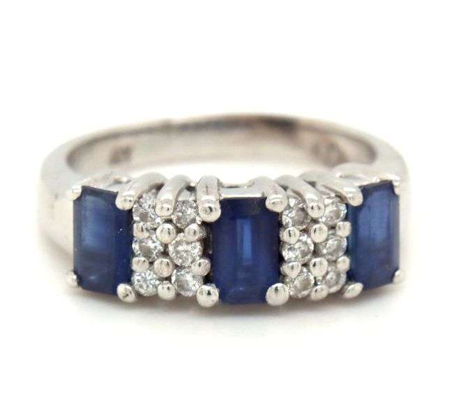 14kt White gold 1.10ctw emerald cut sapphire and diamond accent ring