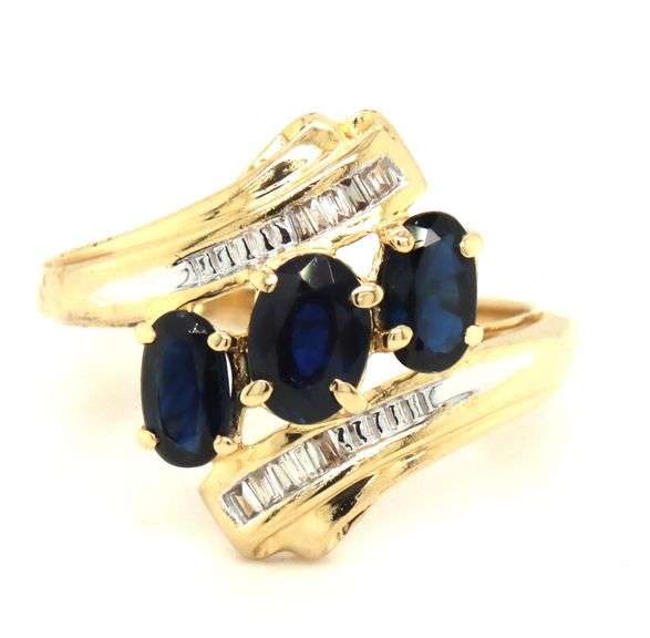 14kt Yellow gold 3 oval sapphire and baguette crossover ring