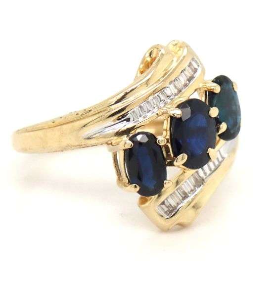 14kt Yellow gold 3 oval sapphire and baguette crossover ring