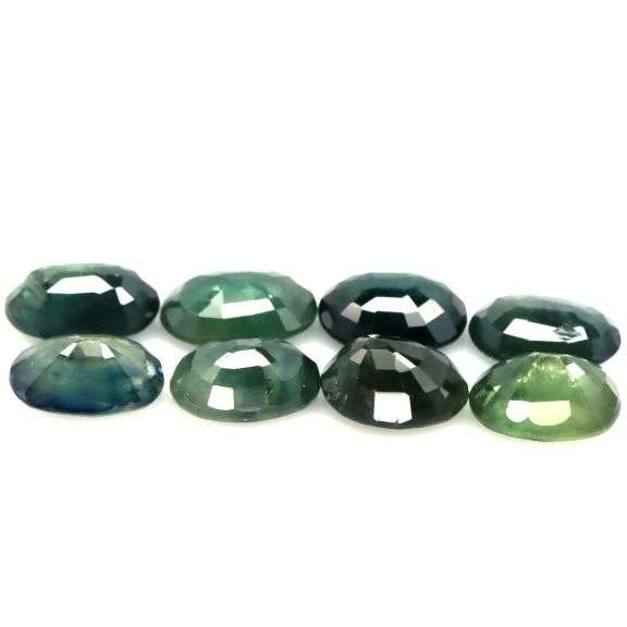 Heated only! 9.60ct blue green Sapphire set