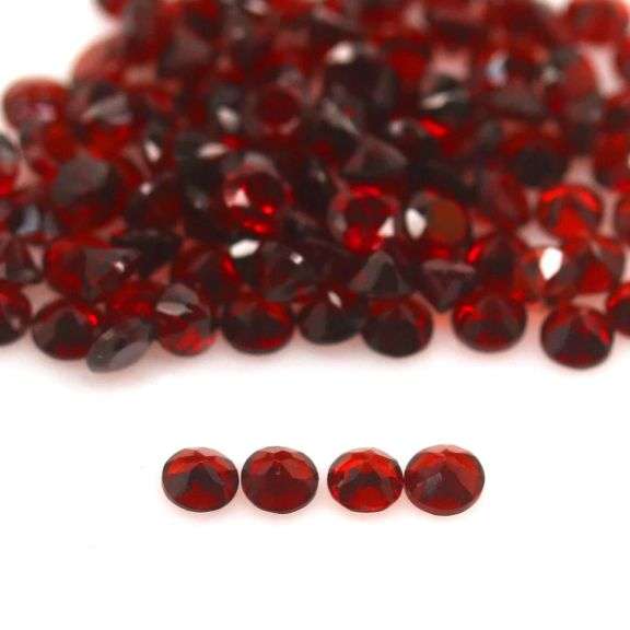 Outstanding 12.24ct diamond cut high fire Mozambique Garnet set
