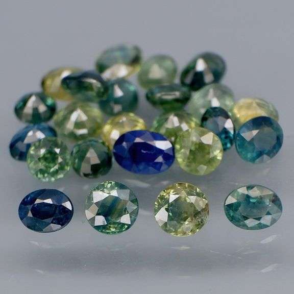 Heated only! 6.80ct mixed cut blue green Sapphire set