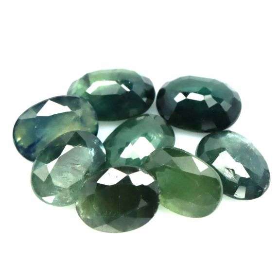 Heated only! 9.60ct blue green Sapphire set