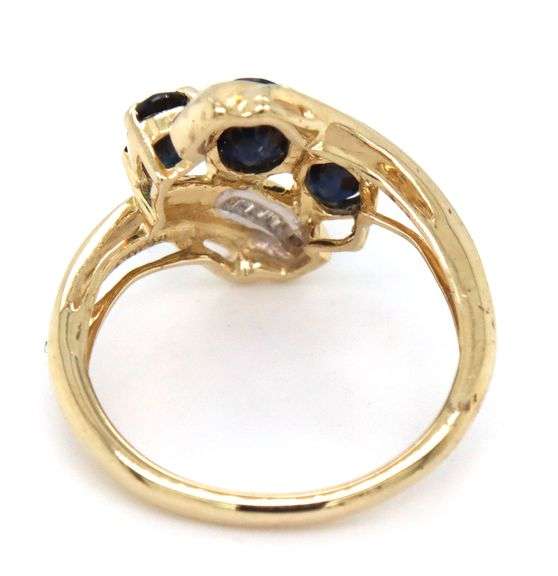 14kt Yellow gold 3 oval sapphire and baguette crossover ring