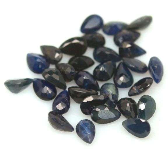 Beautifully colored 9.75ct ink blue Sapphire set
