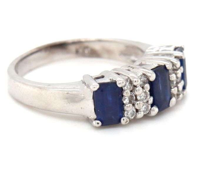14kt White gold 1.10ctw emerald cut sapphire and diamond accent ring