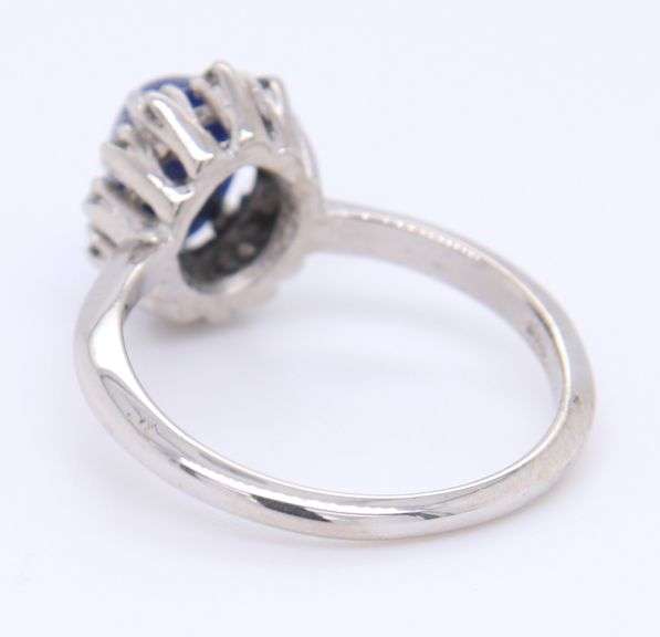 14kt White Gold oval Blue Star Sapphire and Diamond Halo Ring
