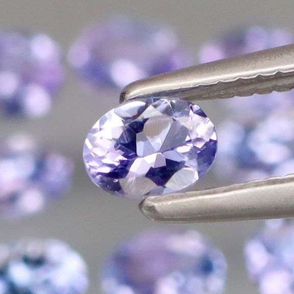 Heavy flashing 2.06ct oval cut Tanzanite set