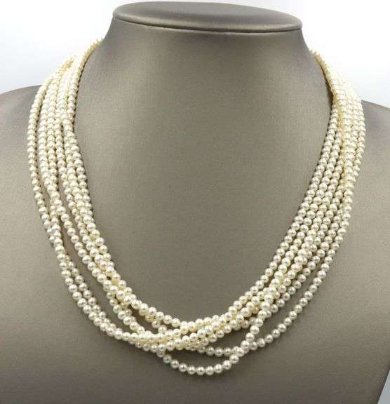 Multi strand pearl necklace with yellow gold clasp