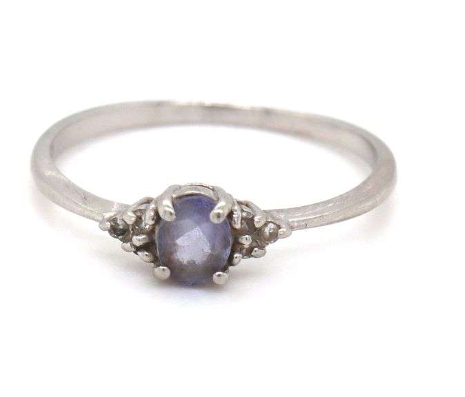 Platinum oval blue star and diamond ring