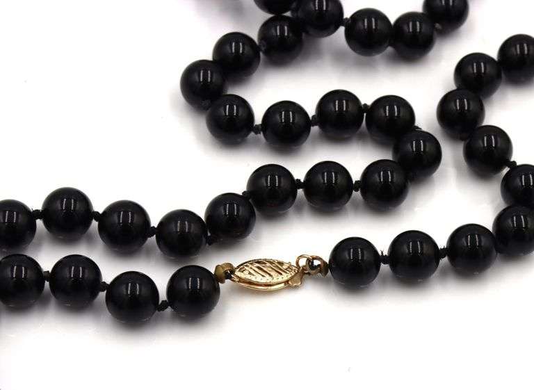 Set of black onyx beaded necklace, bracelet and stud