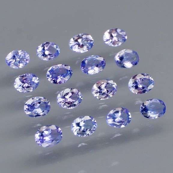 Heavy flashing 2.84ct oval cut Tanzanite set