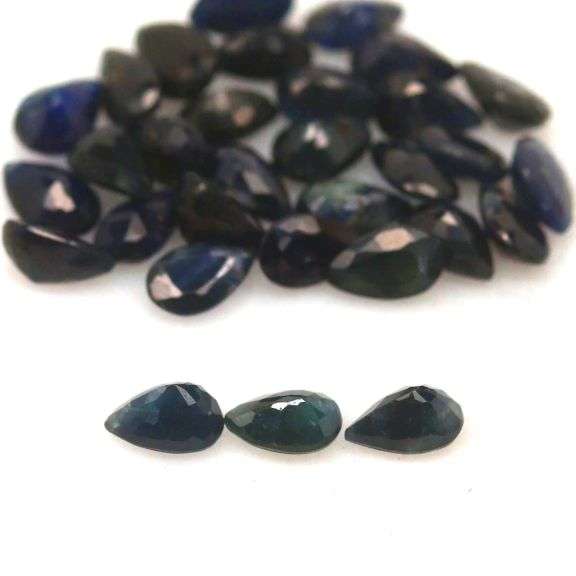 Beautifully colored 9.75ct ink blue Sapphire set