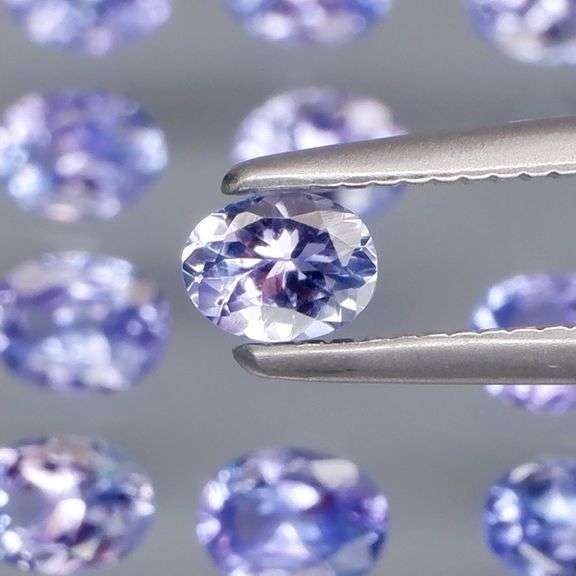 Heavy flashing 2.84ct oval cut Tanzanite set