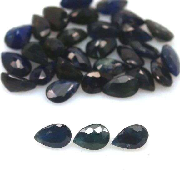 Beautifully colored 9.75ct ink blue Sapphire set