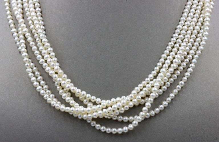 Multi strand pearl necklace with yellow gold clasp