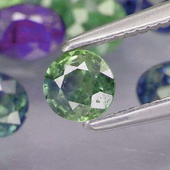 Heated only! 6.80ct mixed cut blue green Sapphire set