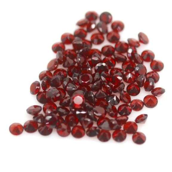 Outstanding 12.24ct diamond cut high fire Mozambique Garnet set