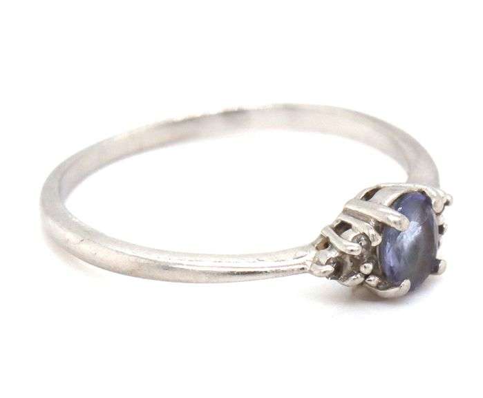 Platinum oval blue star and diamond ring
