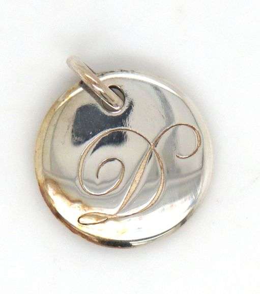 Tiffany & Co. D notes charm in 925 sterling silver