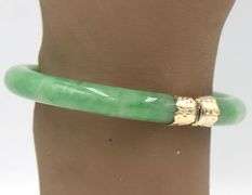 Green Jade hinged bangle bracelet in yellow gold