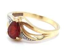 Set of 10kt yellow gold garnet ring and pendant
