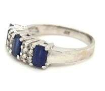 14kt White gold 1.10ctw emerald cut sapphire and diamond accent ring