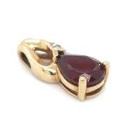 Set of 10kt yellow gold garnet ring and pendant