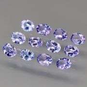 Heavy flashing 2.06ct oval cut Tanzanite set