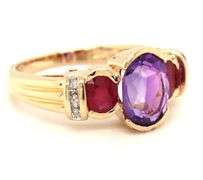14kt Yellow gold oval amethyst, ruby and diamond accent 3 stone ring