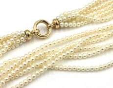 Multi strand pearl necklace with yellow gold clasp