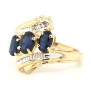 14kt Yellow gold 3 oval sapphire and baguette crossover ring