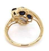 14kt Yellow gold 3 oval sapphire and baguette crossover ring