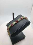 Very fine hand made 25 ctw ruby and 18 emeralds bracelet