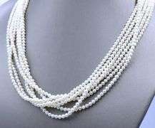 Multi strand pearl necklace with yellow gold clasp
