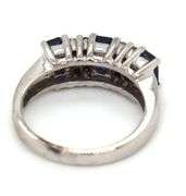 14kt White gold 1.10ctw emerald cut sapphire and diamond accent ring