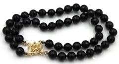 Set of black onyx beaded necklace, bracelet and stud
