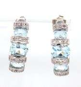 14kt White gold 2.50ctw aquamarine and diamond accent earrings