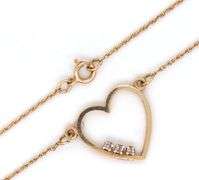 14kt Yellow gold heart shaped 3 stone diamond pendant on chain