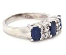 14kt White gold 1.10ctw emerald cut sapphire and diamond accent ring