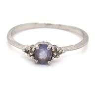 Platinum oval blue star and diamond ring