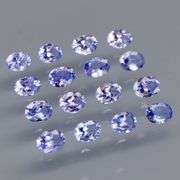 Heavy flashing 2.84ct oval cut Tanzanite set