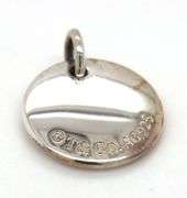 Tiffany & Co. D notes charm in 925 sterling silver