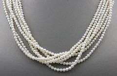 Multi strand pearl necklace with yellow gold clasp