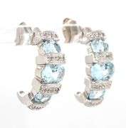 14kt White gold 2.50ctw aquamarine and diamond accent earrings