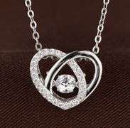 Beautiful heart shape center dancing stone pendant