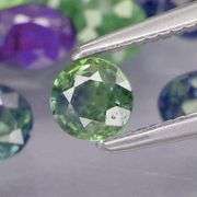 Heated only! 6.80ct mixed cut blue green Sapphire set