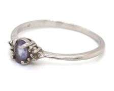 Platinum oval blue star and diamond ring