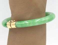 Green Jade hinged bangle bracelet in yellow gold